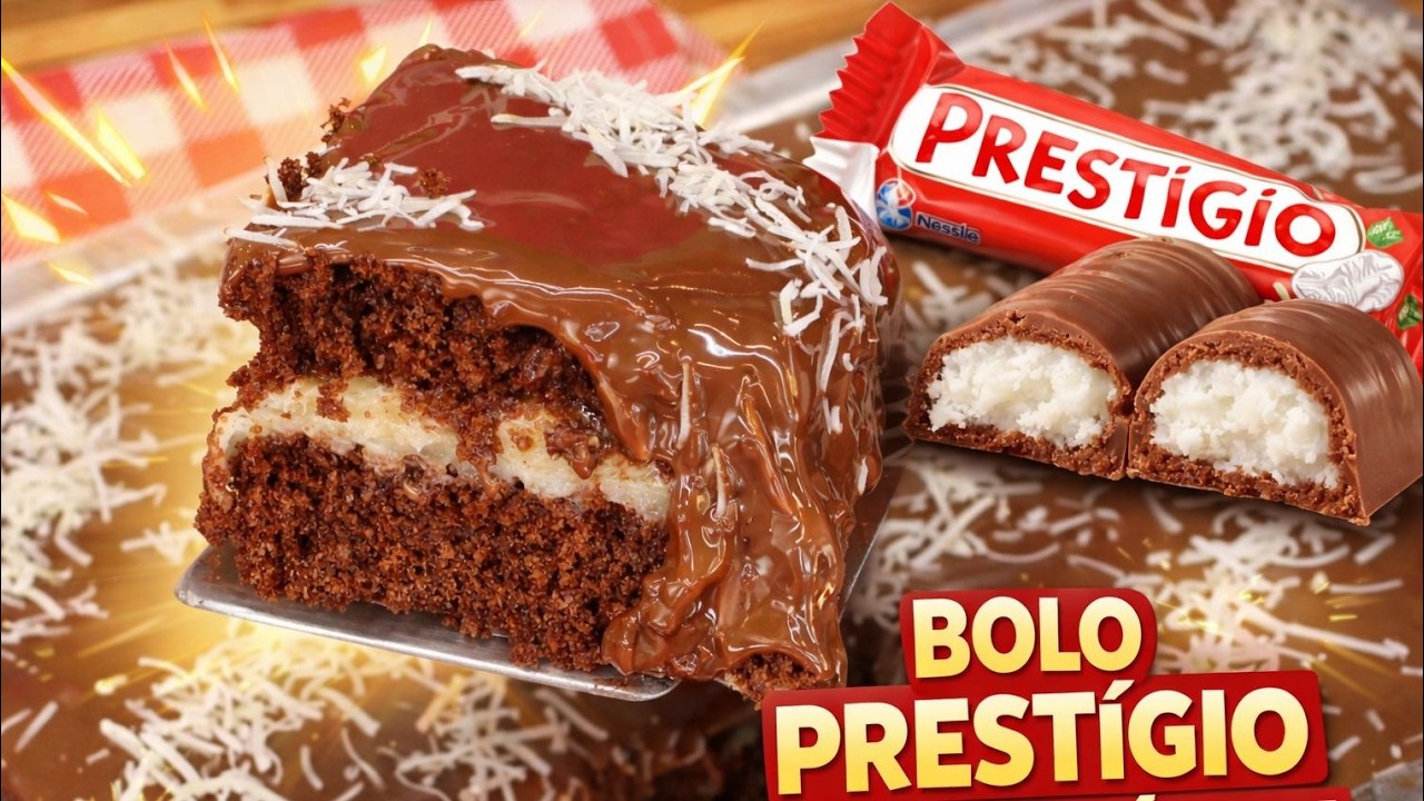 Bolo prestígio caseiro com cobertura de chocolate e recheio cremoso de coco